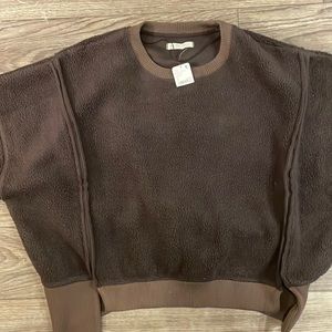 Brand new. Brown Medium Free People Fleece Sweater.